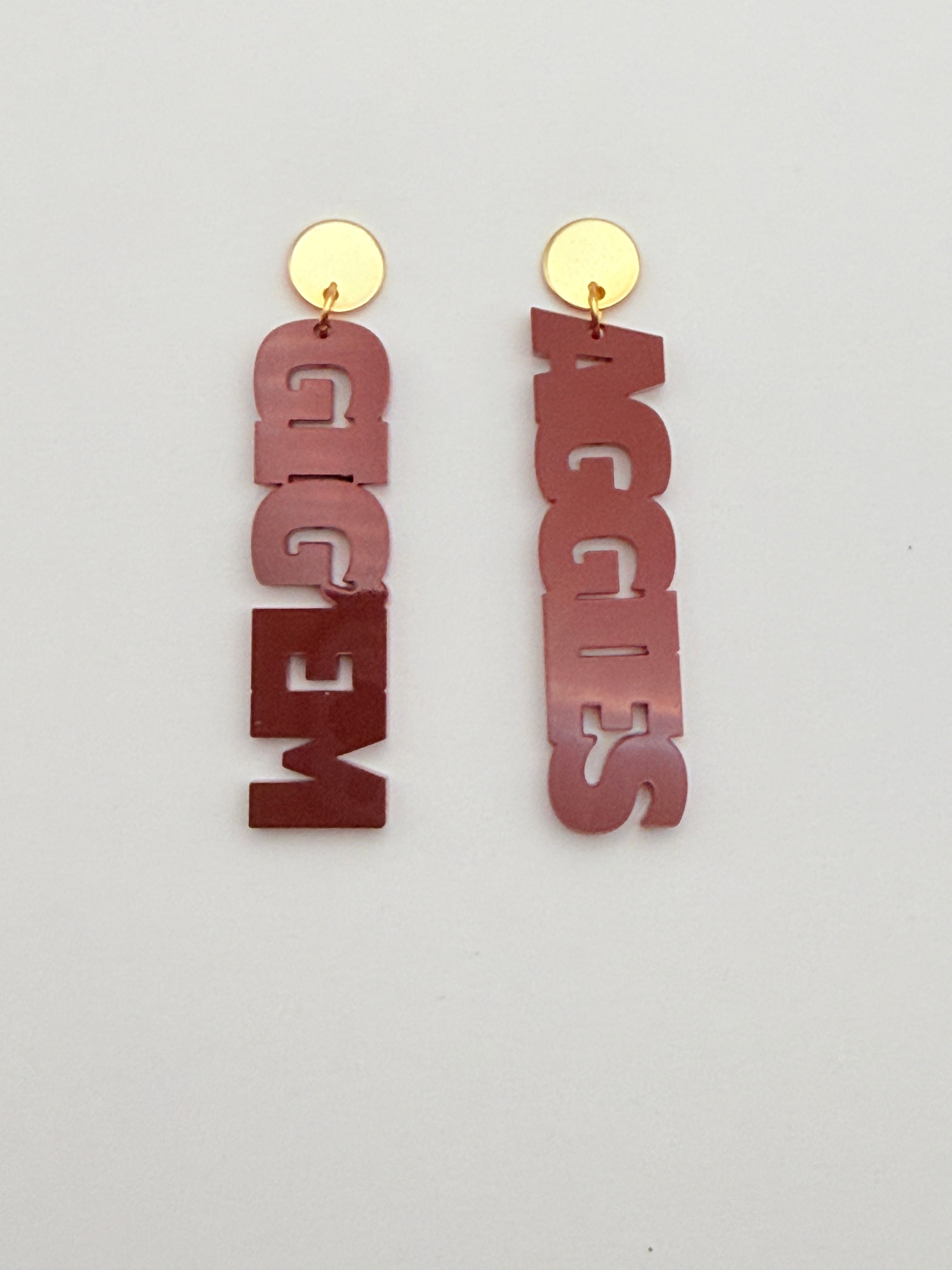 Metallic 'AGGIES' and 'GIG'EM' letters on a light gray background