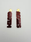 Decorative wall art with 'AGGIES' and 'GIGEM' text on a plain background