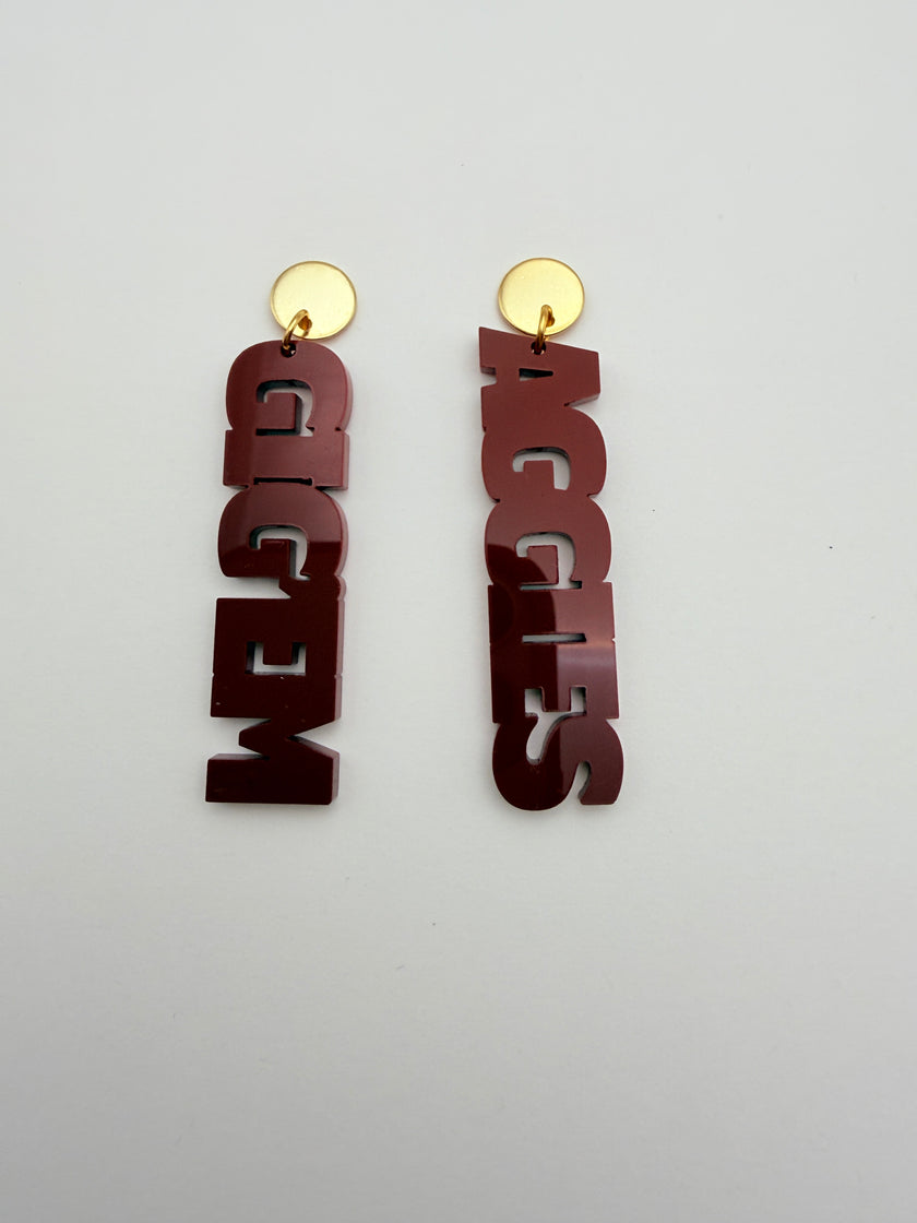 Decorative wall art with 'AGGIES' and 'GIGEM' text on a plain background