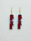 Ole Miss earrings with red text on a light gray background