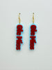 Ole Miss earrings with red text on a light gray background