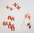 A flat-lay display of various geometric and abstract dangle earrings on a clean white background. The earrings feature terracotta orange, white, brown glitter, and gold-tone metal in shapes like lightning bolts, arches, and stylized figures.