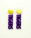 Pair of earrings with yellow heart tops and purple 'TIGERS' letters on a white background