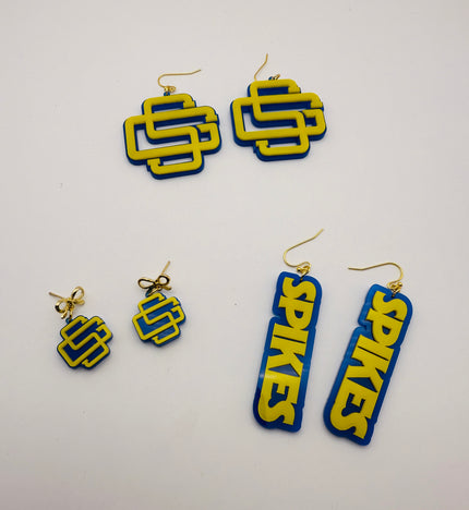 Pair of blue and yellow earrings on a white background
