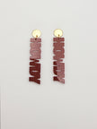 Wooden 'HOWDY' earrings with gold hooks on a white background