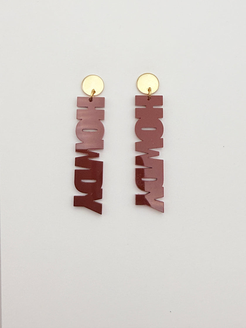 Wooden 'HOWDY' earrings with gold hooks on a white background