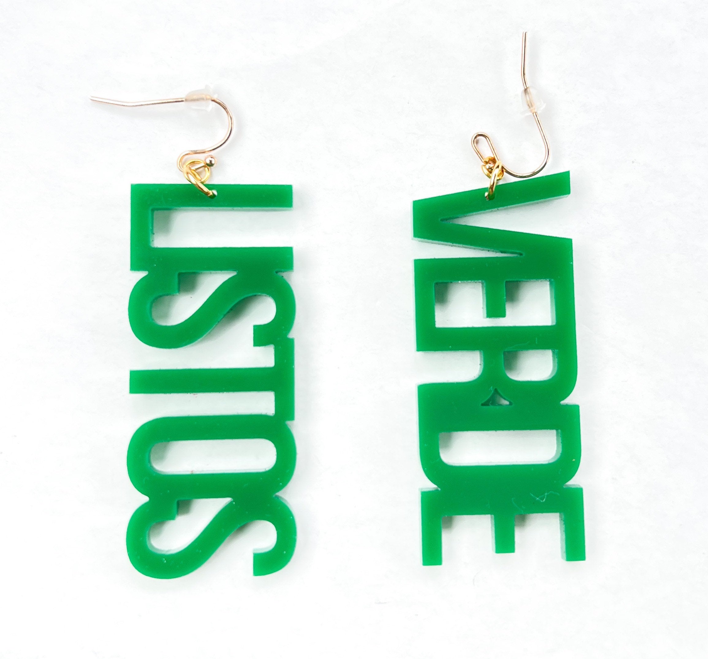 A pair of green acrylic earrings with 'LISTOS VERDE' written in bold letters, attached to gold-colored earwires.