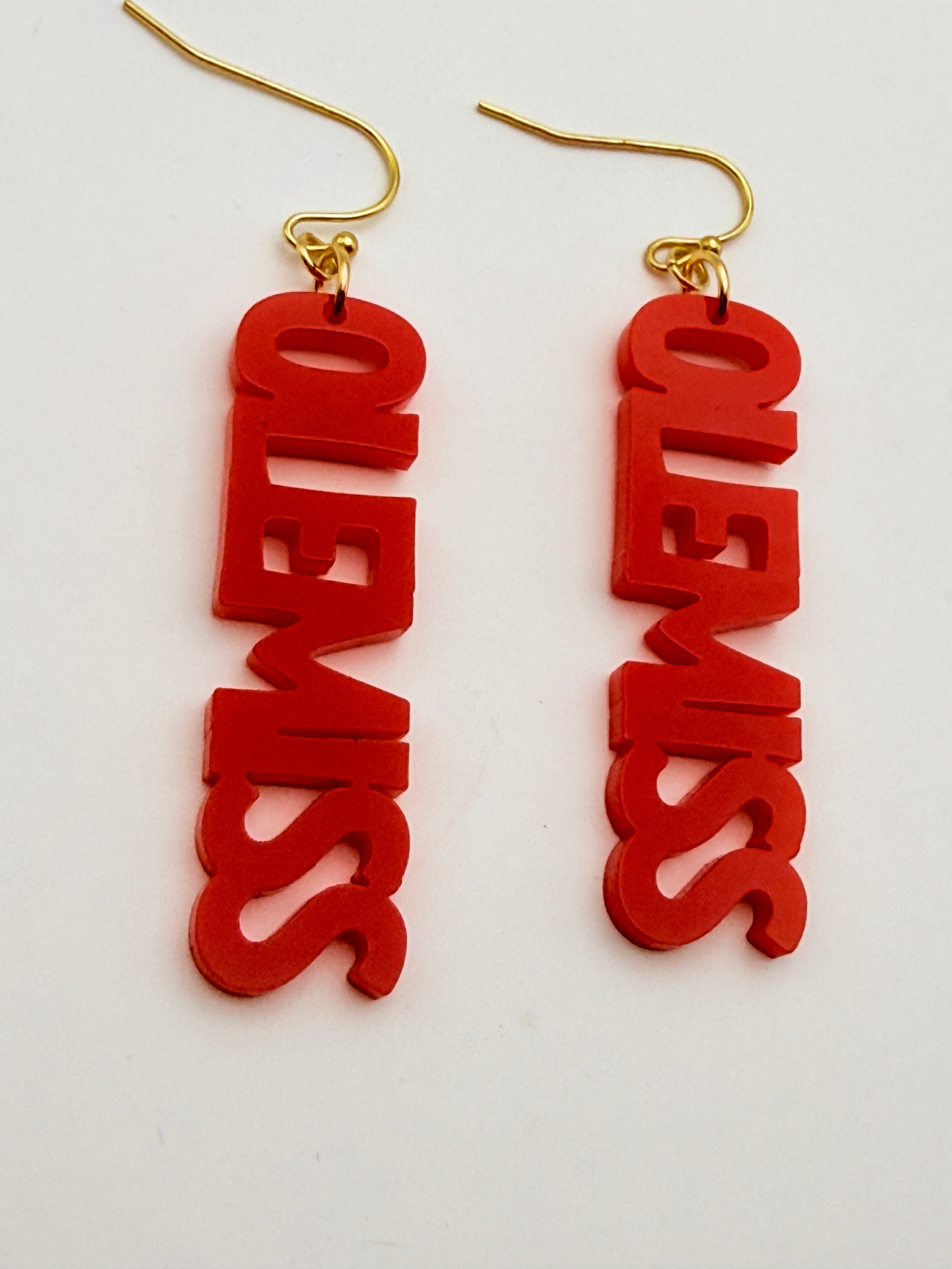 Red 'OLEMISS' earrings with gold hooks on a white background