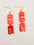 Red 'OLE MISS' earrings with gold hooks on a light gray background