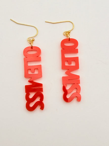 Red 'OLE MISS' earrings with gold hooks on a light gray background
