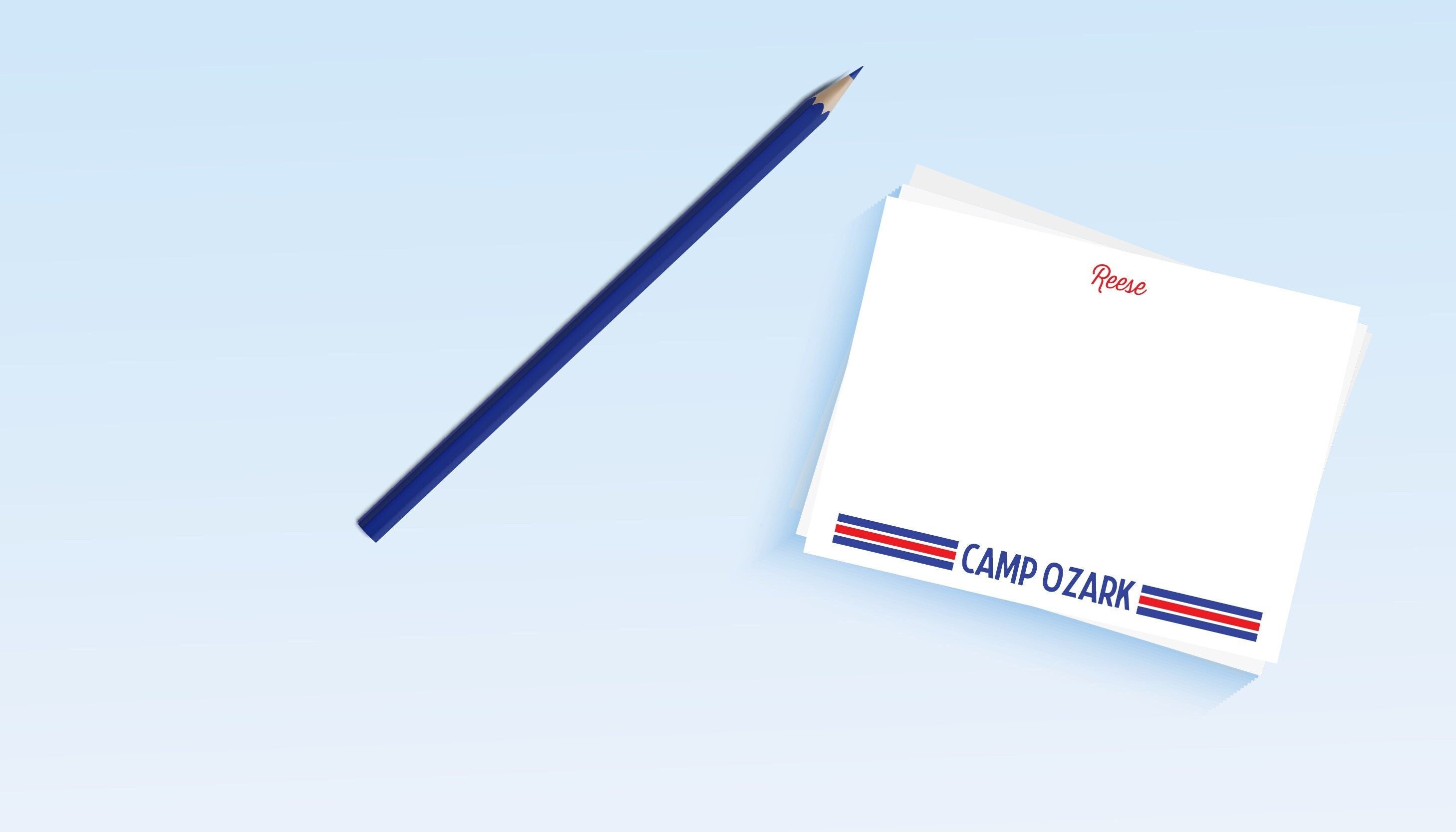A set of personalized camp stationery with 'Camp Ozark' stripes, including notecards and a pencil, displayed on a light background.