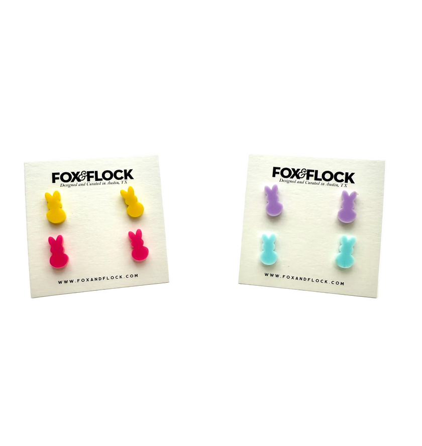 Acrylic bunny-shaped earrings in yellow, pink, blue, and purple colors, displayed on white cards with 'FOX&FLOCK' branding.