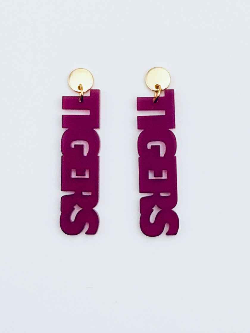 Purple 'Tigers' earrings on a light gray background