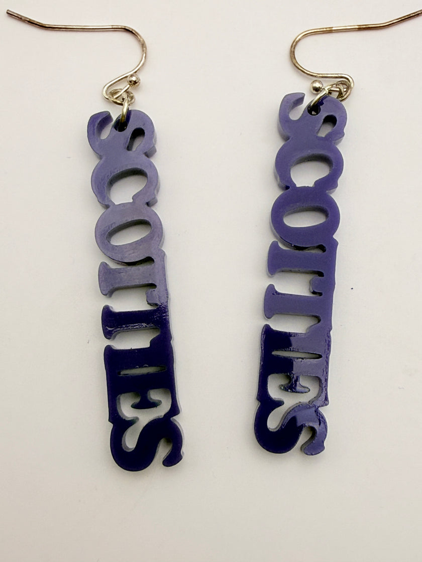 Pair of earrings with 'SCOTTIES' text on a white background