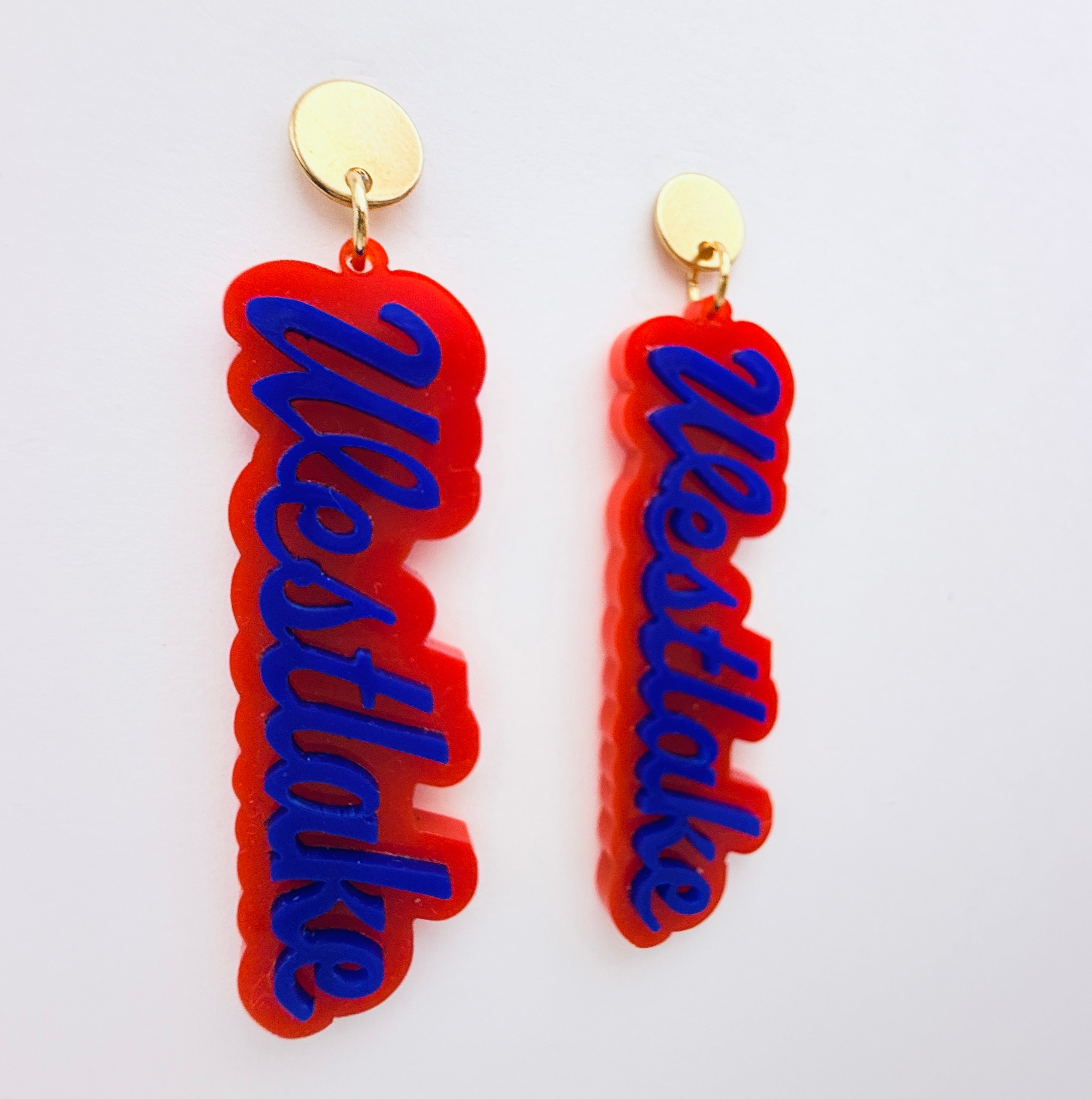 Red and blue 'Westlake' earrings on a white background