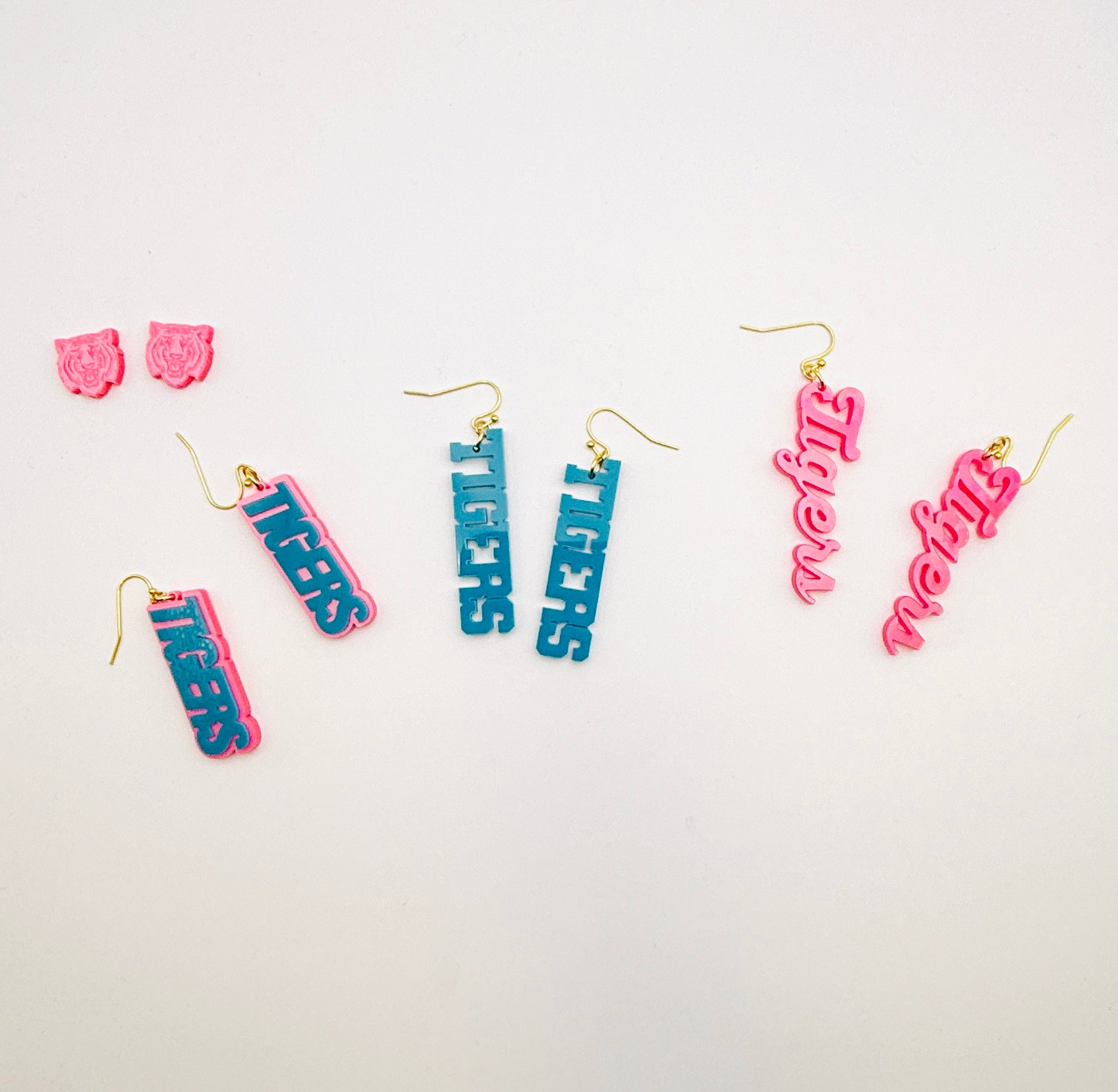 Colorful 'neon' earrings on a white background
