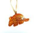 Orange armadillo ornament with a gold ribbon on a white background